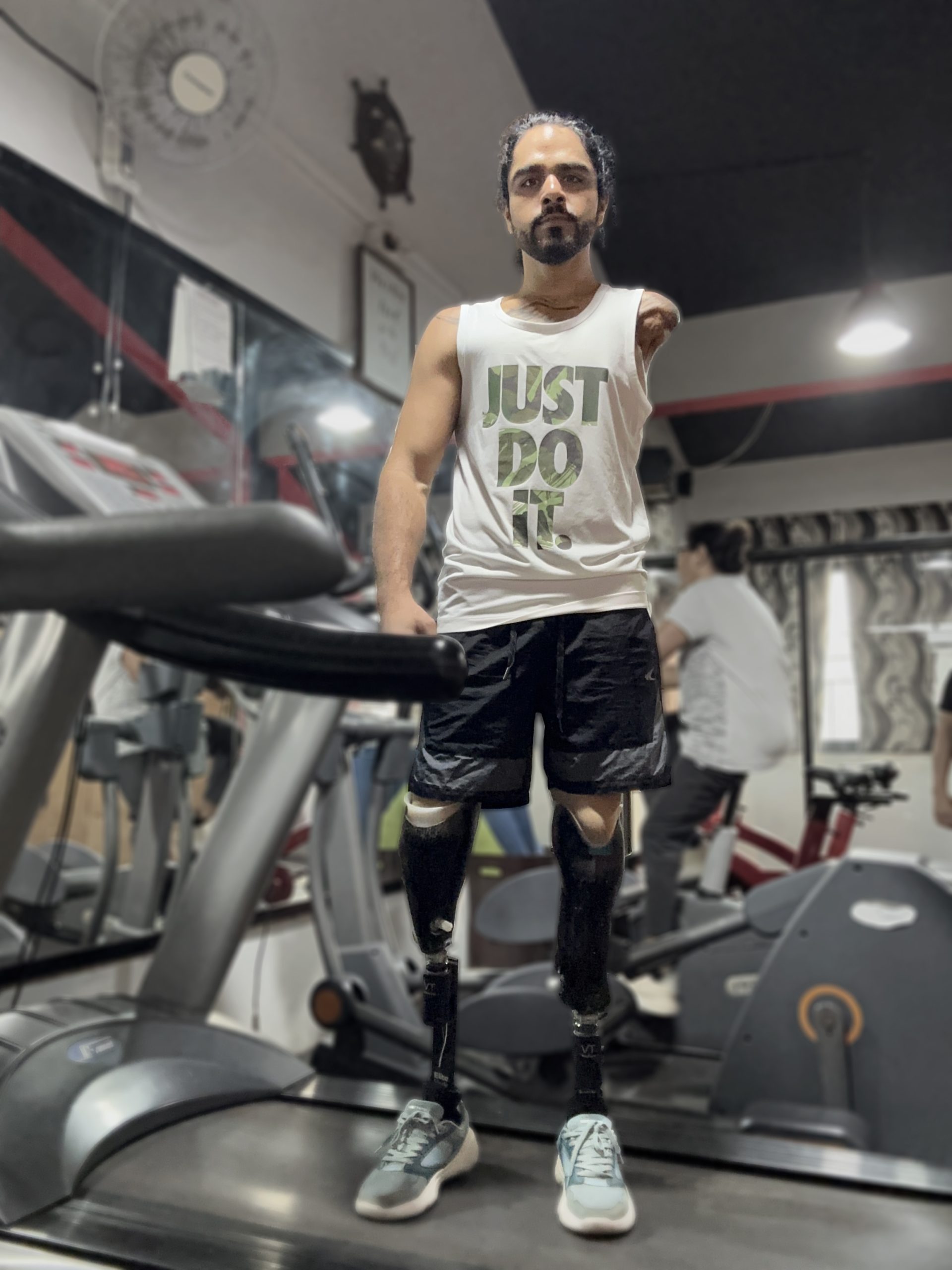 Tinkesh Kaushik in sports attire standing on a treadmill.