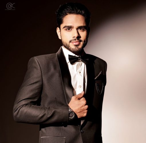 A portrait picture of Tinkesh Kaushik in a suit.
